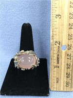 Sterling silver ring set with pink quartz, face is