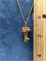 10K gold chain with a 14k gold pendant in the shap