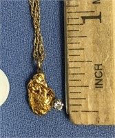Gold nugget and diamond pendant on a 14K gold chai
