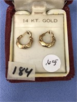 A pair of 14K gold hoop earrings, beautifully engr