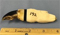 4.5" polar bear claw mounted with a carved ivory p