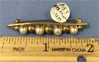 An ivory and pearl Victorian pin, not marked, weig
