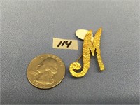Gold nugget pin made into the letter "M" weight: 4