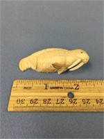 Fossilized walrus ivory, 2.5" walrus done by C.B.O