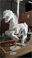 white carosel horse