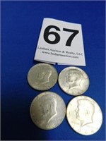 Four 1964 silver Kennedy halves (all D)