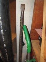 Group of yard tools: sledge hammers, pry bars,