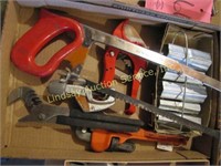 Flat w/ plumbing tools, pliers, pipe wrench,