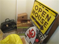 Lot under stairs: box fan, bag, open house signs,