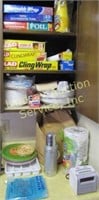 3 shelves & countertop of paper goods, thermos,