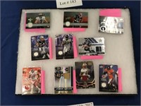 ASSORTMENT OF NFL TRADING CARDS WITH PIECES OF
