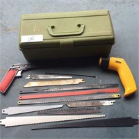 Green plastic tool box with handsaws