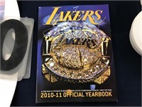 2010-2011 LAKERS YEARBOOK SIGNED BY LAMAR ODOM