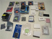 LOT OF CAMERA BATTERIES AND CHARGERS