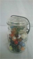 Vintage ball pint jar with the glass lid full of