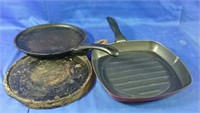2 cast iron pans and a grill megaware pan