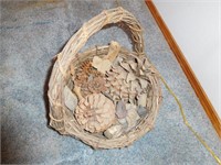 BASKET OF PINE CONES, PETRIFIED WOOD AND ROCKS