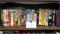 SHELF OF VHS TAPES, BATMAN, TEN COMMANDMENTS