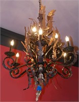 A FAUX PAINTED TIN AND IRON FOLIATE CHANDELIER