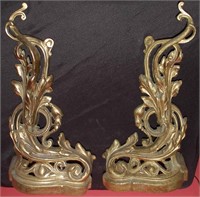 A PAIR OF BRASS ROCOCO ANDIRONS