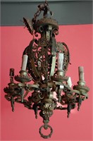 AN ORNATE CAST, WROUGHT & PAINTED IRON CHANDELIER