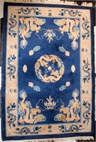 A HAND MADE CHINESE AREA RUG