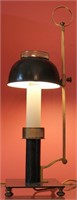 AN ART DECO BRASS AND BLACK ENAMEL TABLE LAMP