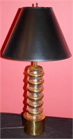A VINTAGE MID C. BRASS AND STACKED DISK TABLE LAMP