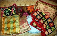 A COLLECTION OF DECORATIVE PILLOWS