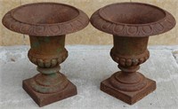 A PAIR OF CAST IRON CAMPAGNA FORM URNS