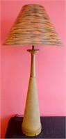 A CANED WOOD MID 20TH CENTURY TABLE LAMP