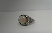VERY LIVELY FIRE OPAL SET IN PLATINUM FILIGREE