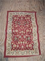 Maroon and white rug