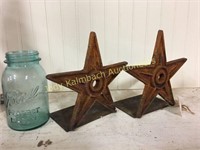 Set of rusty Cast iron Texas star Bookends