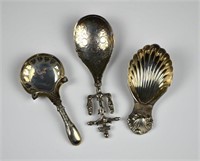 THREE ANTIQUE SILVER CADDY SPOONS