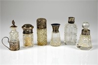 SIX CUT GLASS AND SILVER SCENT BOTTLES