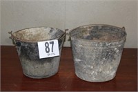 Pair metal buckets with holes in the bottom