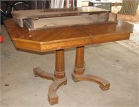 Wood table with two leaves. Measures 30" h x 51"