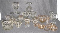 Clear glass items with gold trim including