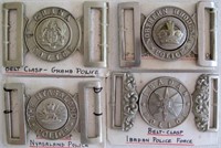 Four early African Police belt buckles