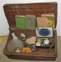 Wicker trunk style basket with vintage books,
