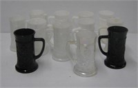 (12) White and black glass stein style mugs.
