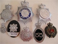 Eight various UK police metal helmet plates