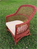 Red wicker chair w/ red stripe ticking cushion