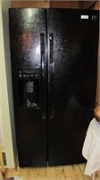 Side by side refrigerator. Black exterior. Door