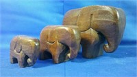 Three hand carved wooden elephants