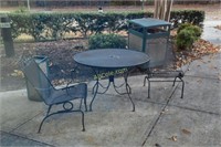 1 Outdoor round table; black, with 2 chairs.