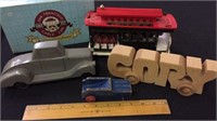 THREE VINTAGE  WOOD TOY CARS AND MUSICAL CABLE CAR