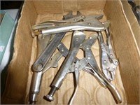 Box of vise grips and adjustable wrench