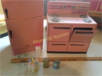 Vintage pink metal kitchen stove an refrigerator